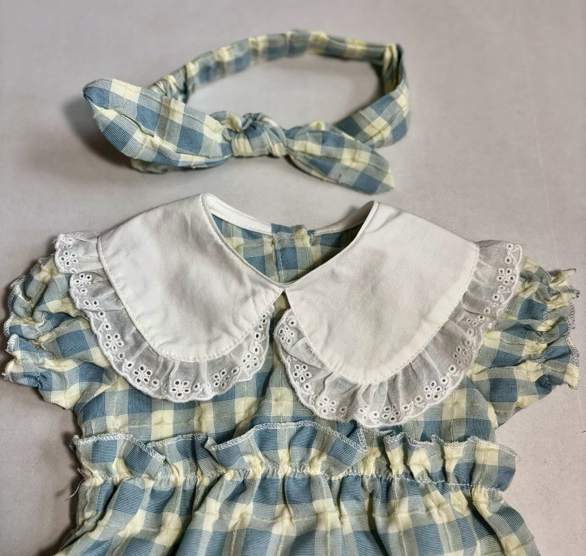 Checked Baby Onesie With Ruffled Collar and Matching Headband